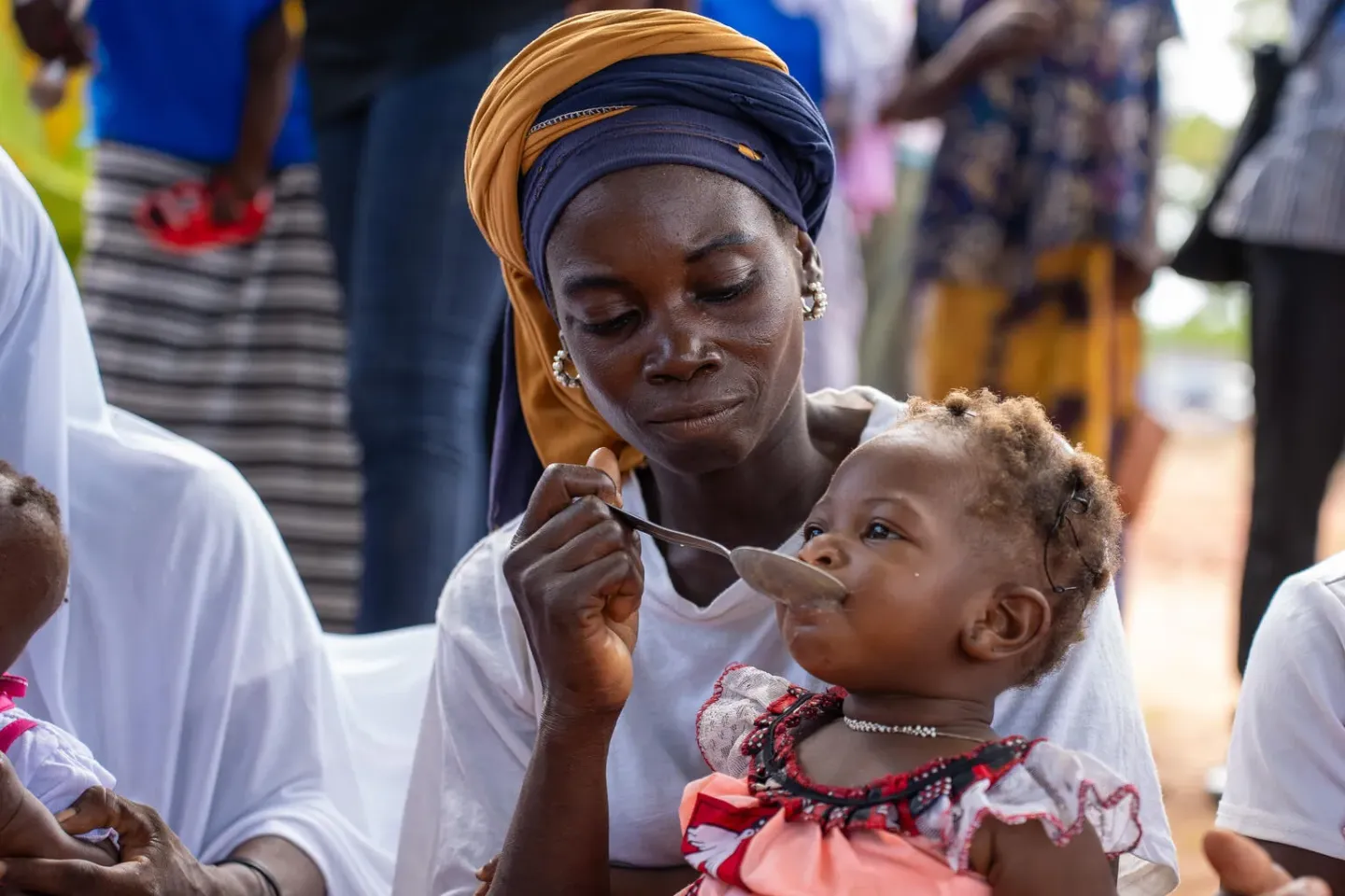 A mother feeds her child